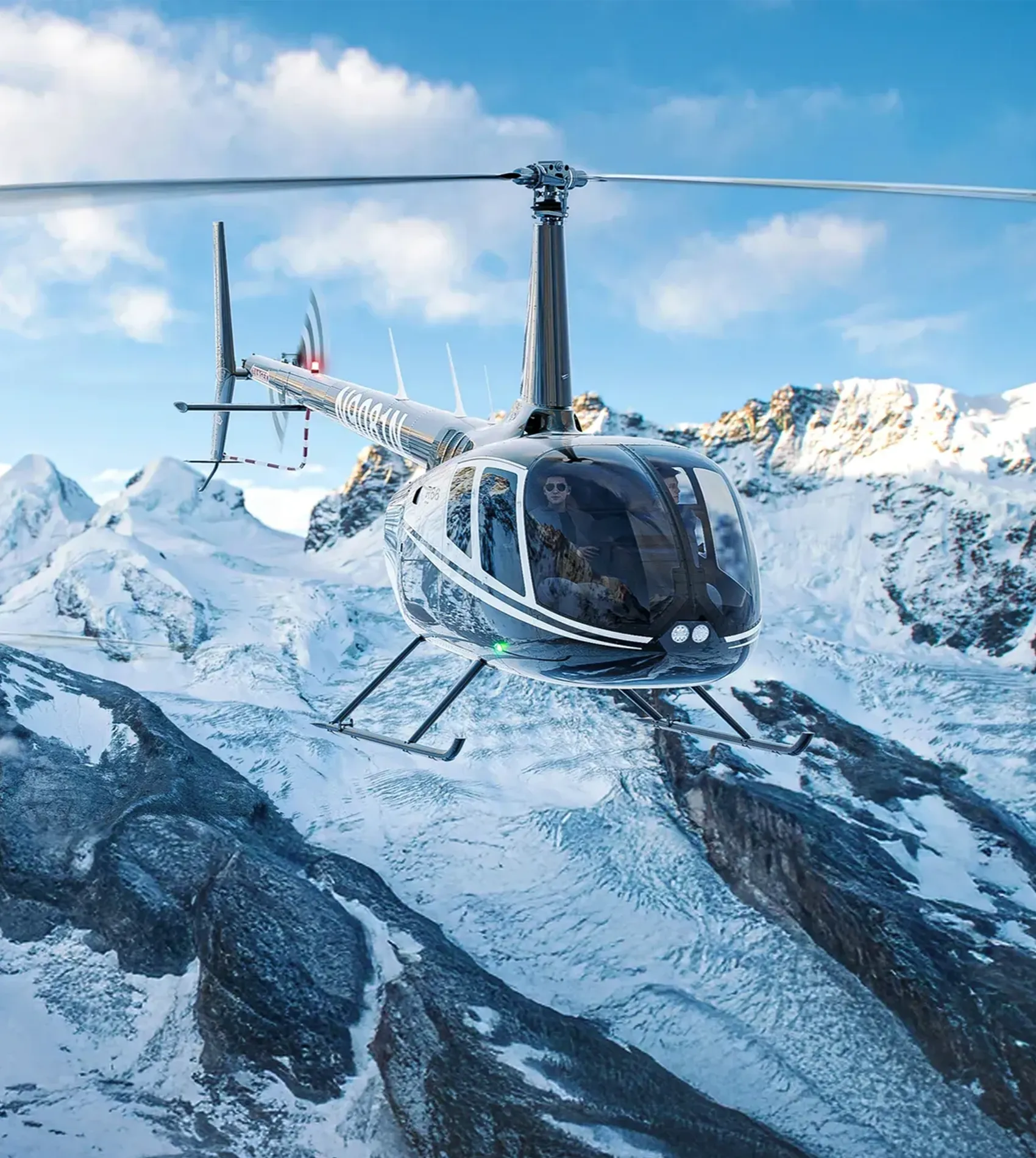 Helicopter flying in snowy mountain range