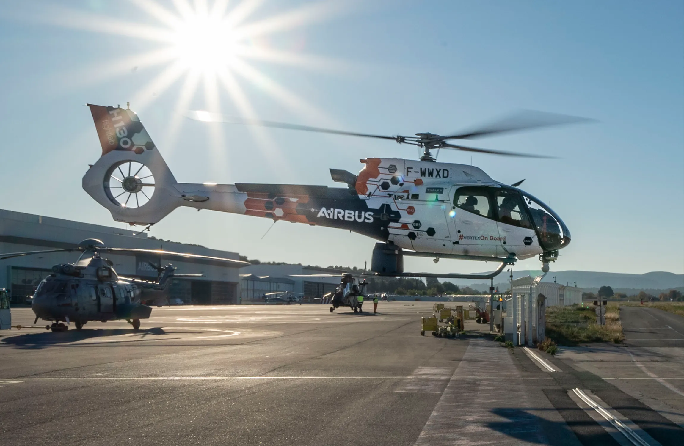 A helicopter taking off from an airport