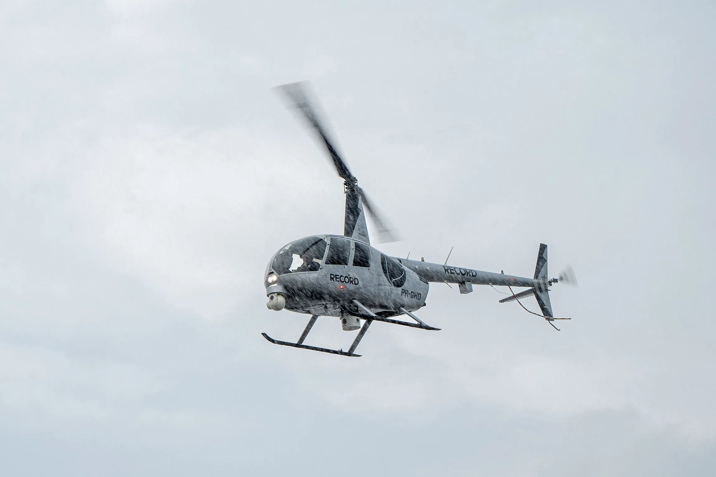 A helicopter flying through the rain