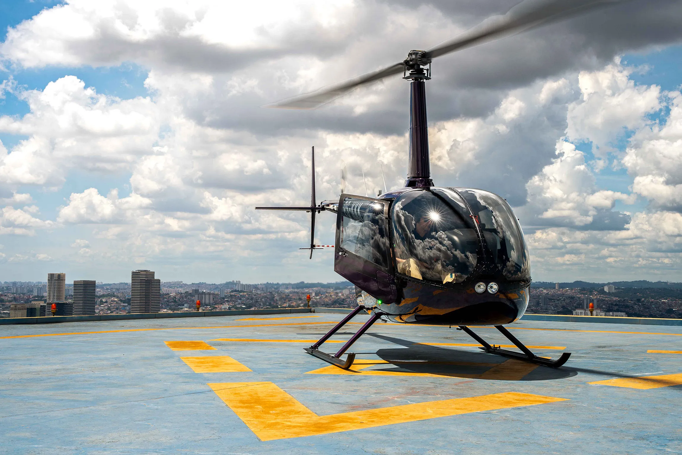 A helicopter parked on a rooftop